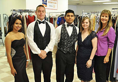 Teens trying on clothers at the Prom Closet
